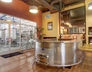 Modern wine tasting bar with outdoor seating area at 90 Plus Wine Club in Napa Valley.