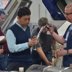People tasting wine at a winery, enjoying a wine tasting experience in Napa Valley.